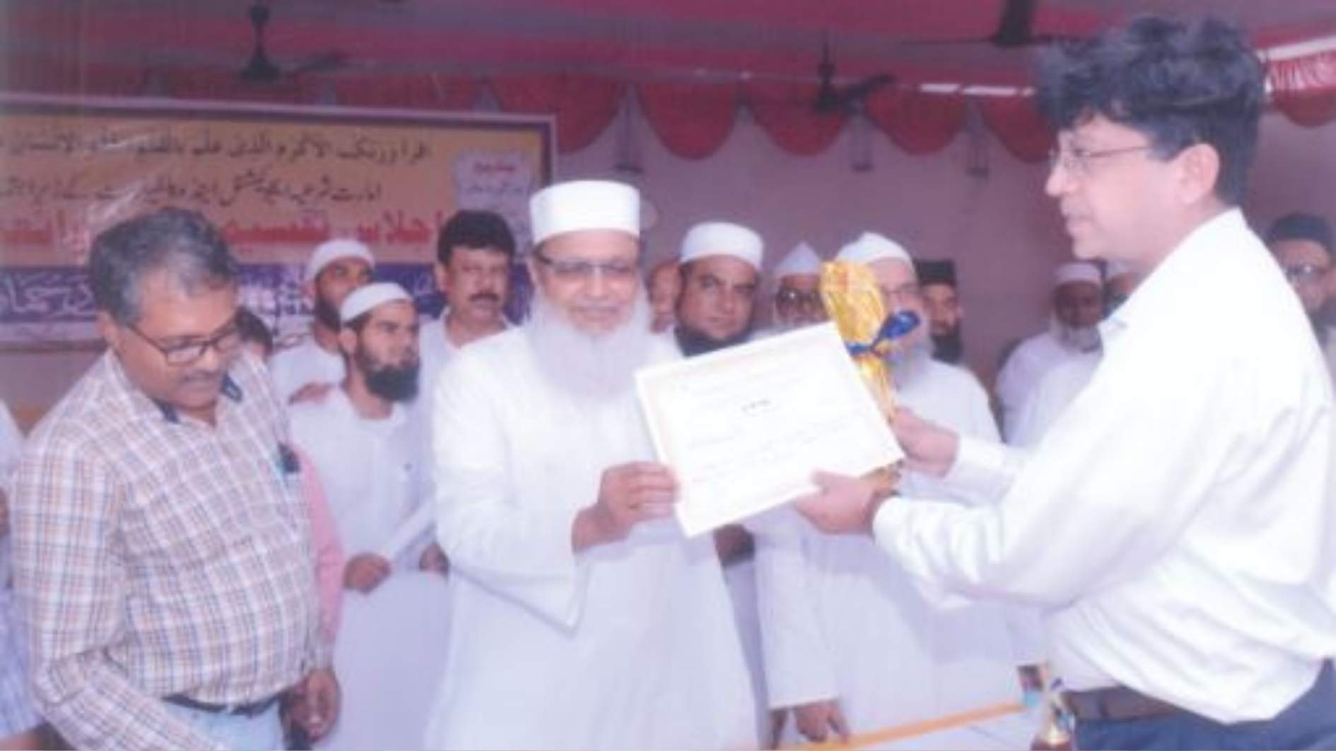 Mr. Syed Nesar Ahmad (Adminstrator) Receiving his awardby Ameer Shariyat